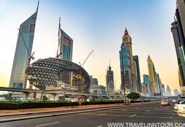 Cityscape of Dubai featuring futuristic architecture including the iconic Museum of the Future and surrounding skyscrapers under a clear sky.